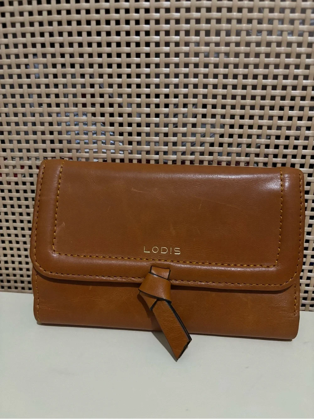 Lodis wallet brown leather featuring knotted tap detail